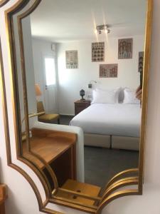 a person taking a picture of a bedroom with a bed at Dar Nour in Tangier +133 photos