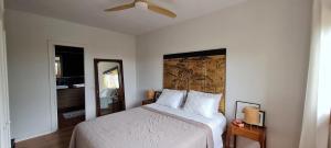 a bedroom with a bed and a map on the wall at Casa Las Picoteras in La Estación