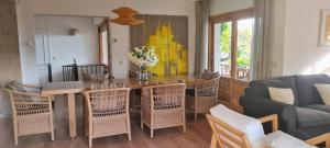 a living room with a table and chairs and a couch at Casa Las Picoteras in La Estación +24 photos