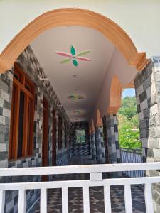 an entrance to a building with a ceiling fan at HIMALAYAN ESCAPE HOMESTAy in Sari