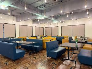 a dining room with tables and chairs and chalkboards at Sylvara Resort in Sasan Gir