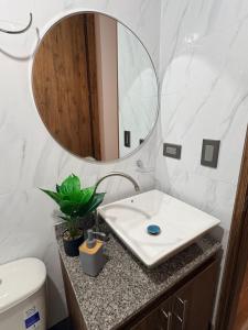 a bathroom with a white sink and a mirror at Villa Celeste Guaduas El Mirador in Guaduas +31 photos