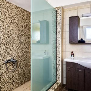 a bathroom with a glass shower and a sink at Gennadi Villa Mare 300m from the Beach in Gennadi +27 photos