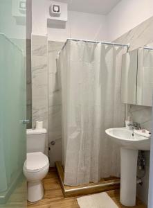 a bathroom with a toilet and a sink and a shower at Villa Athina BC in Serres +21 photos
