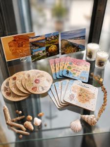 a glass table with pictures and other items on it at Info Hotel in Palanga +43 photos