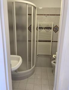 a bathroom with a shower and a sink and a toilet at luca in Vernazza +22 photos