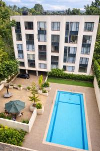 an overhead view of a building with a swimming pool at Ongata Rongai Pool Studio Near Nairobi National Park and giraffe center in Ongata Rongai 