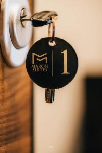 a key chain on a door with the number on it at MARON in Kalavrita