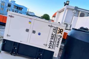 a white truck with a sign on the side of it at 1.6 • Balcony • Generator • Parking • 2nd Floor in Mayaguez +46 photos