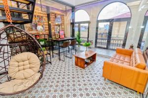 a living room with a couch and a table at 5.4 Loft • Lobby • Generator • Parking • 2nd Floor in Mayaguez