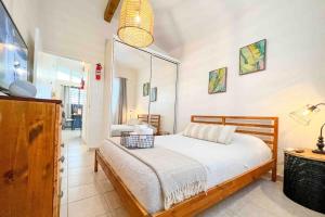 a bedroom with a bed and a mirror at 3.7 Near Beach • Generator • Hammock • 2nd floor in Garita