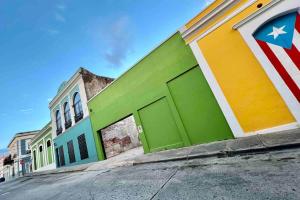 a building with an american flag painted on it at 5.5 Loft • Lobby • Generator • Parking • 2nd Floor in Mayaguez