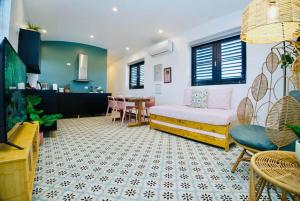 a living room with a couch and a table at 5.7 Penthouse • Generator • Parking • 3rd floor in Mayaguez +51 photos