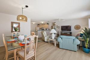a living room with a table and a dining room at Patio Villa in Santo Domingo in The Villages