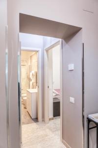 an open doorway to a room with a bathroom at Cerenea House BiancAntò in Isola del Liri +6 photos