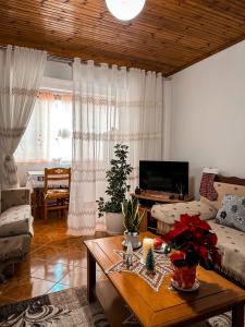 a living room with a couch and a table at Sweet home Leskovik in Leskovik