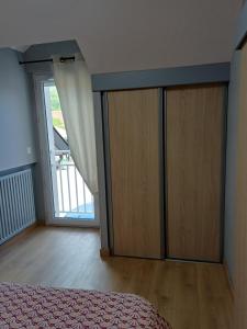 a bedroom with a bed and a sliding glass door at Le Conty in Saint-Jorioz +60 photos