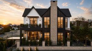 a house with a black and white facade at Light House Villa in Da Lat