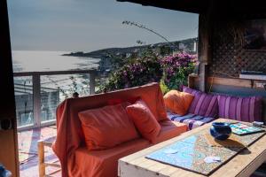 a living room with a couch and a table at Nizar Surf Morocco in Taghazout