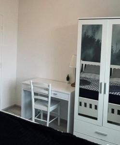 a bedroom with a desk and a bunk bed at Waterfall apartment in Plitvička Jezera