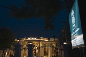 a building with a gate in front of it at night at The Edition Signature in Bahawalpur