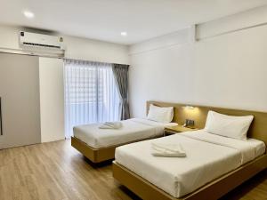 Postel nebo postele na pokoji v ubytování LIMOR hotel