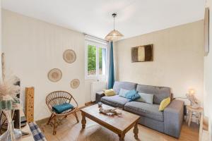 a living room with a couch and a table at Les Gîtes Du Saro in Chabestan