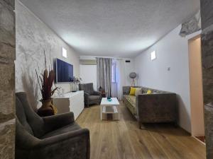 a living room with a couch and a table at Casa Di Kotor in Kotor