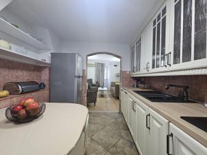 a kitchen with a bowl of fruit on a counter at Casa Di Kotor in Kotor