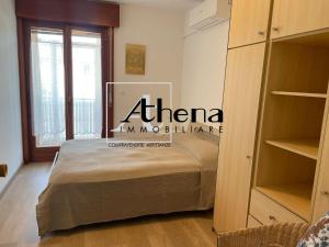 a bedroom with a bed in a room at Sole in Grado