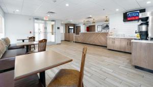 a fast food restaurant with a table and chairs at Atria Hotel and RV McGregor in McGregor