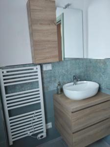 a bathroom with a sink and a mirror at Casa Osvaldo in Marciana +12 photos