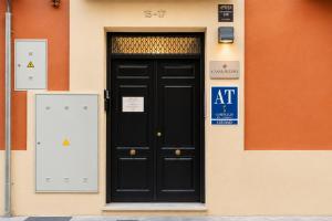 a black door on the side of a building at Casa Lavanda by Blossom Hotels in Granada