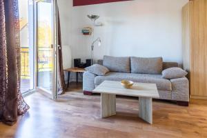 a living room with a couch and a coffee table at Ferienwohnung Schlossperle in Klütz