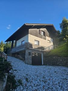 a house sitting on top of a rocky hill at Ferienhaus Birker in Kleinfeistritz