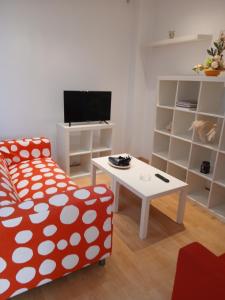 a living room with a couch and a table at Cecilia in Muros