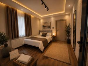 a hotel room with a bed and a table at MarinaBlueGarden34 in Karaburun