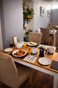 a table with plates of food on top of it at The Lyncroft in Newquay