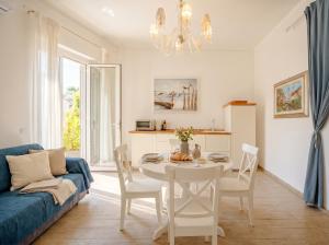 a living room with a table and a blue couch at Nido Blu in Polignano a Mare