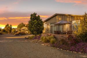 a house with an umbrella in front of it at Ranch House at Galway Downs in Temecula