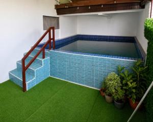 a model of a swimming pool with stairs and plants at Zoldyck Villa 1 in Bacolod