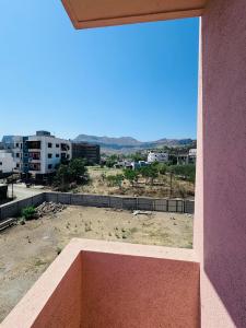 a window of a building with a view of a city at Hotel Siyaram Inn in Trimbak