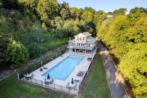 an aerial view of a large house with a swimming pool at Captain's Quarters in Smithville