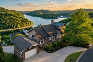 an aerial view of a house with a river at Captain's Quarters in Smithville