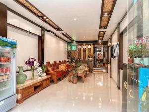 a lobby of a store with couches and tables at Sapa Tom's Hotel in Sapa