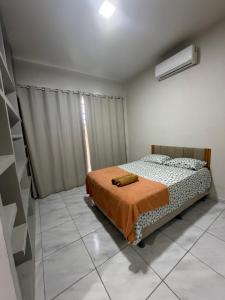 a bedroom with a bed in a room with a window at Pousada Nova Betânia in Mossoró +9 photos