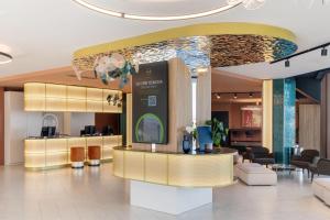 a lobby with a waiting area in a mall at B&B HOTEL Venezia Laguna in Venice