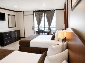 a hotel room with two beds and a window at Beachside Resort in Wildwood +116 photos