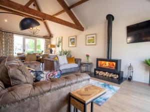 a living room with a couch and a fireplace at 1 Bed in Richmond oc-88588 in Easby