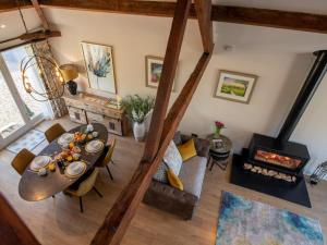 an overhead view of a living room with a table and a fireplace at 1 Bed in Richmond oc-88588 in Easby